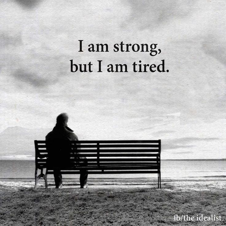 a man sitting on top of a bench next to the ocean with a quote above it