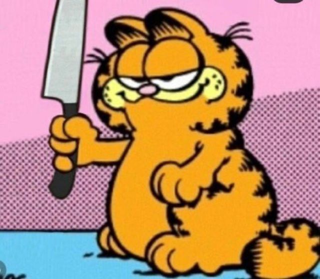 an image of garfield the cat holding a knife