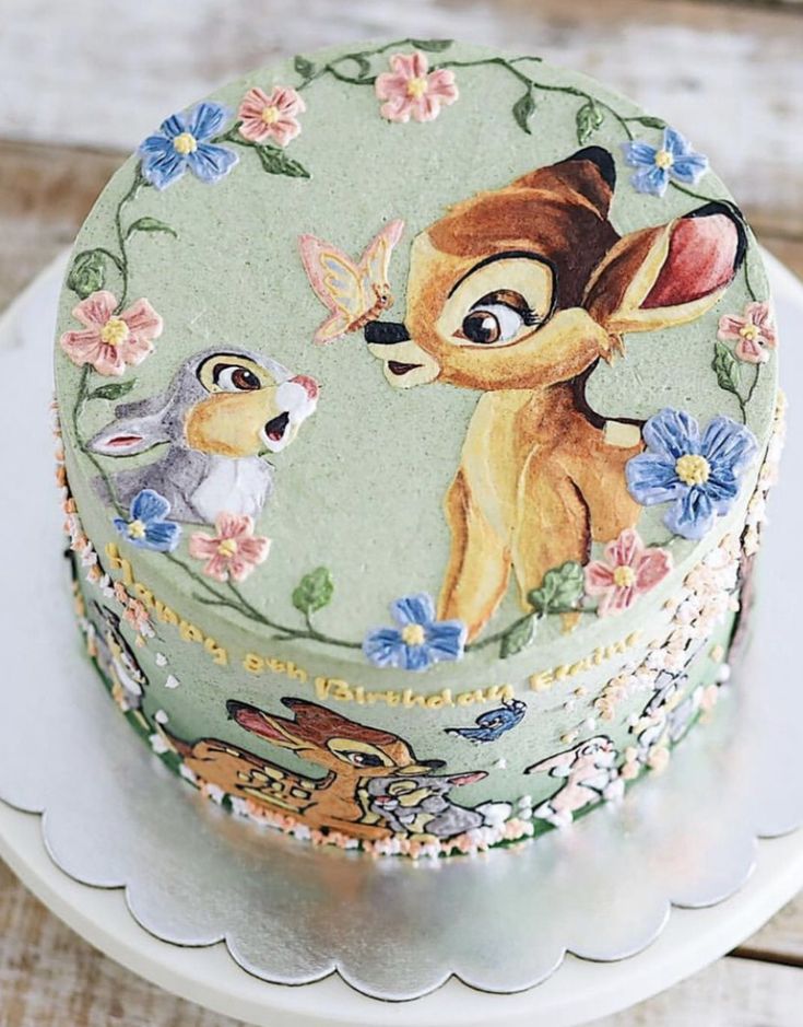 the cake is decorated with an image of lady and the tramp from disney's animated movie