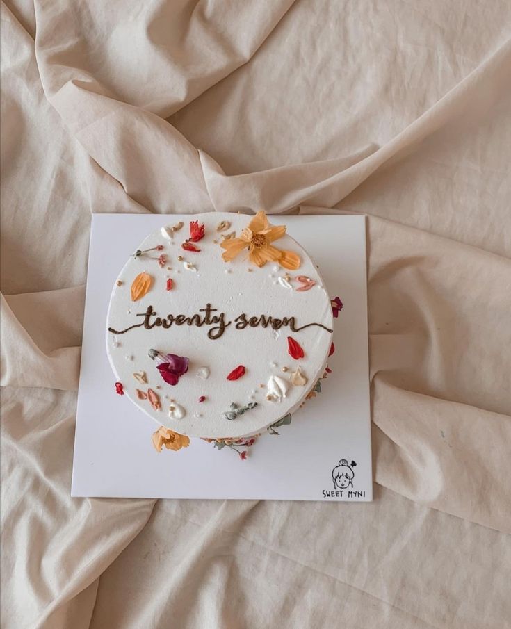 a birthday cake on top of a white card