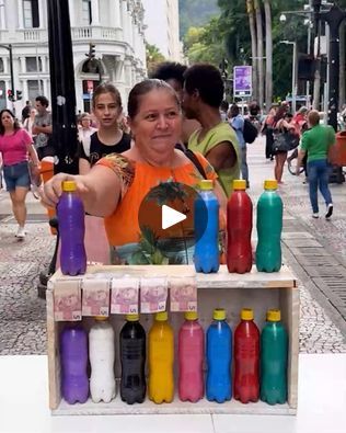 a woman standing in front of a display of bottles