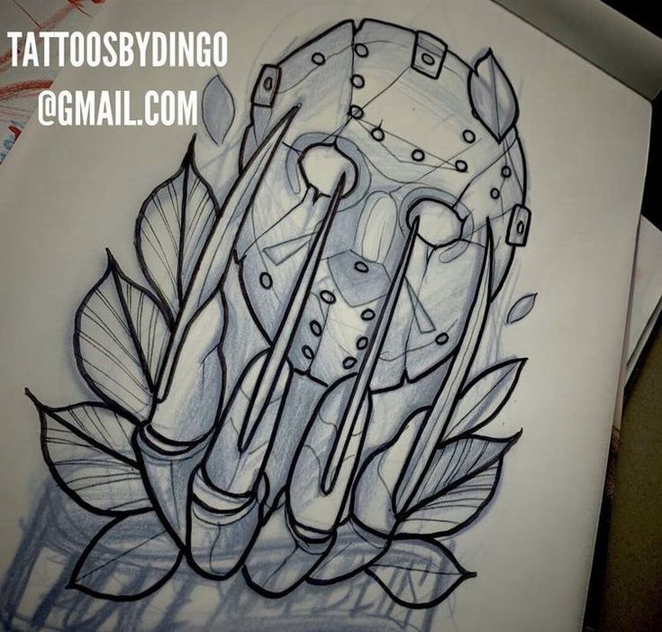 the tattoo design is done on paper with scissors and other things in it's hands