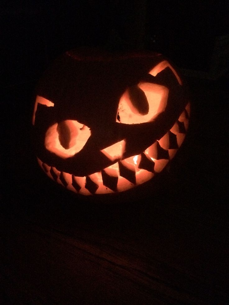 a carved jack o lantern in the dark