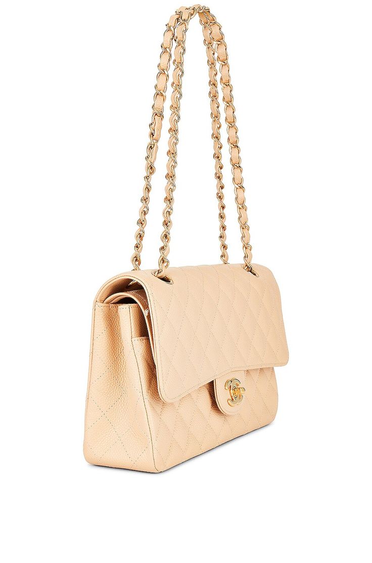 Find CHANEL Classic Double Flap Bag on Editorialist. This Chanel Classic Double Flap Bag is crafted from caviar leather with gold-tone hardware. It features a foldover top with a turnlock closure, one main compartment, a single interior zip pocket, a flat pocket, a divided flat pocket, and a single exterior flat pocket. The bag includes a dust bag and measures approximately 10 inches wide, 6 inches high, and 2.5 inches deep. The shoulder strap has a 9 to 15 inch drop. The bag is in excellent con Classic Beige Double Flap Bags, Chic Double Flap Bag With Cc Turnlock Closure, Chic Bags With Cc Turnlock Closure And Double Flap, Luxury Double Flap Shoulder Bag For Formal Occasions, Luxury Beige Double Flap Shoulder Bag, Luxury Beige Double Flap Bag, Luxury Caviar Leather Evening Bag, Elegant Beige Double Flap Bag, Classic Beige Shoulder Bag With Double Flap