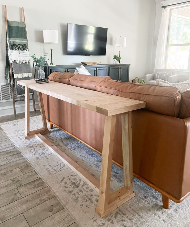 a living room with a couch, table and television