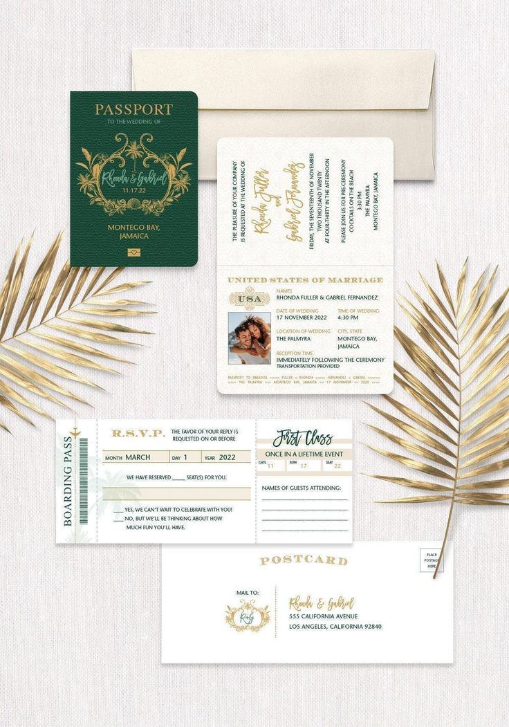 the wedding stationery is laid out with palm leaves