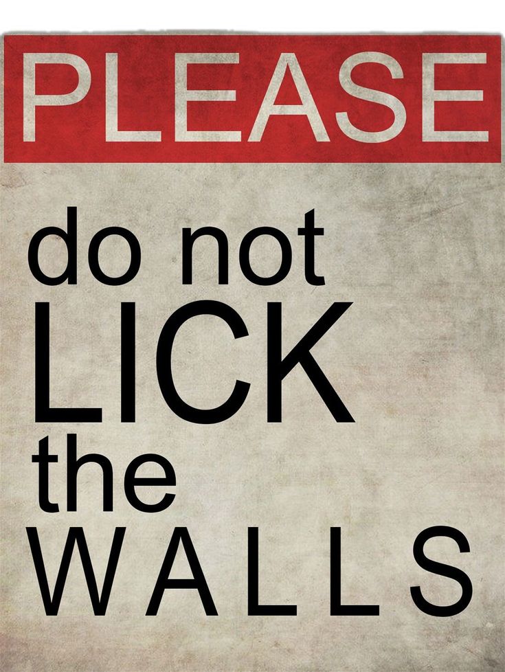 a red and white sign that says please do not lick the walls with black lettering