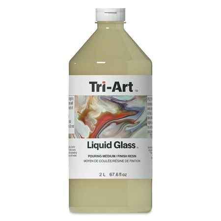 a bottle of liquid that is sitting on a white surface with the words tri - art in it