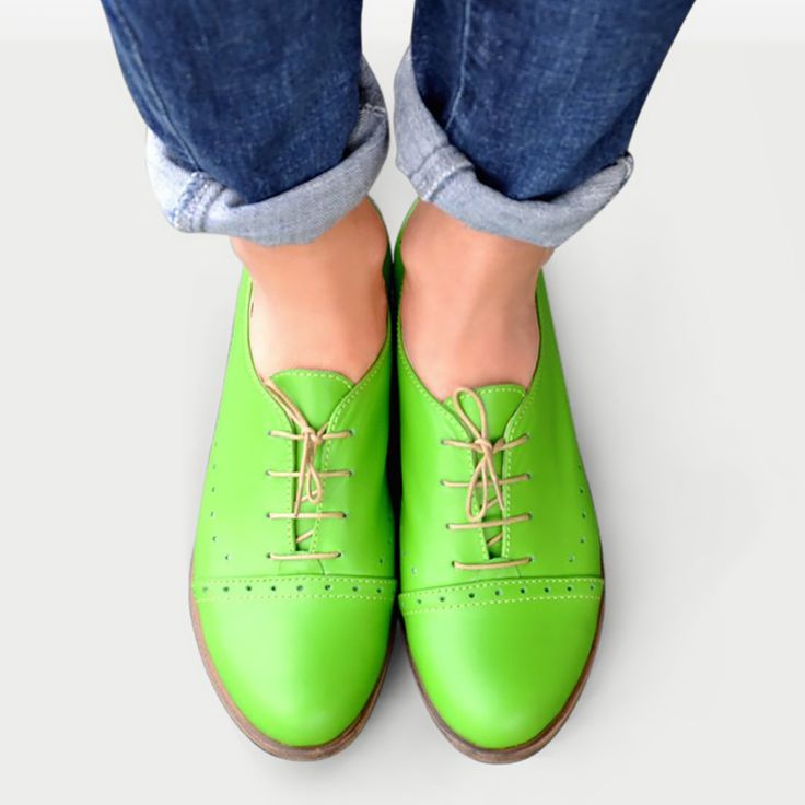 Leather; upper & lining Man-made sole 2.5 cm / 1.0" heel height Handcrafted in Europe Materials: A celebration of bright spring colours, these oxford shoes are built with a slim silhouette design and classic punched detailing. Wear these lace-ups with everything from tailoring to dresses to add a dose of androgynous cool. Material: Tropic Green Soft Leather Laces: Beige & Orange (bonus) Decorations: Brogues, Perforations Sole: Beige #1685 CUSTOMIZEBANNER460991377_ Classic Flat Heel Lace-up Shoes For Spring, Green Leather Shoes With Contrast Sole, Round Toe, Casual Green Leather Shoes With Brogue Detailing, Green Round Toe Leather Shoes For Derby, Green Leather Round Toe Shoes For Derby, Green Leather Shoes For Derby With Round Toe, Spring Lace-up Shoes With Flat Contrast Sole, Green Slip-on Oxfords With Brogue Detailing, Green Brogue Slip-on Oxfords