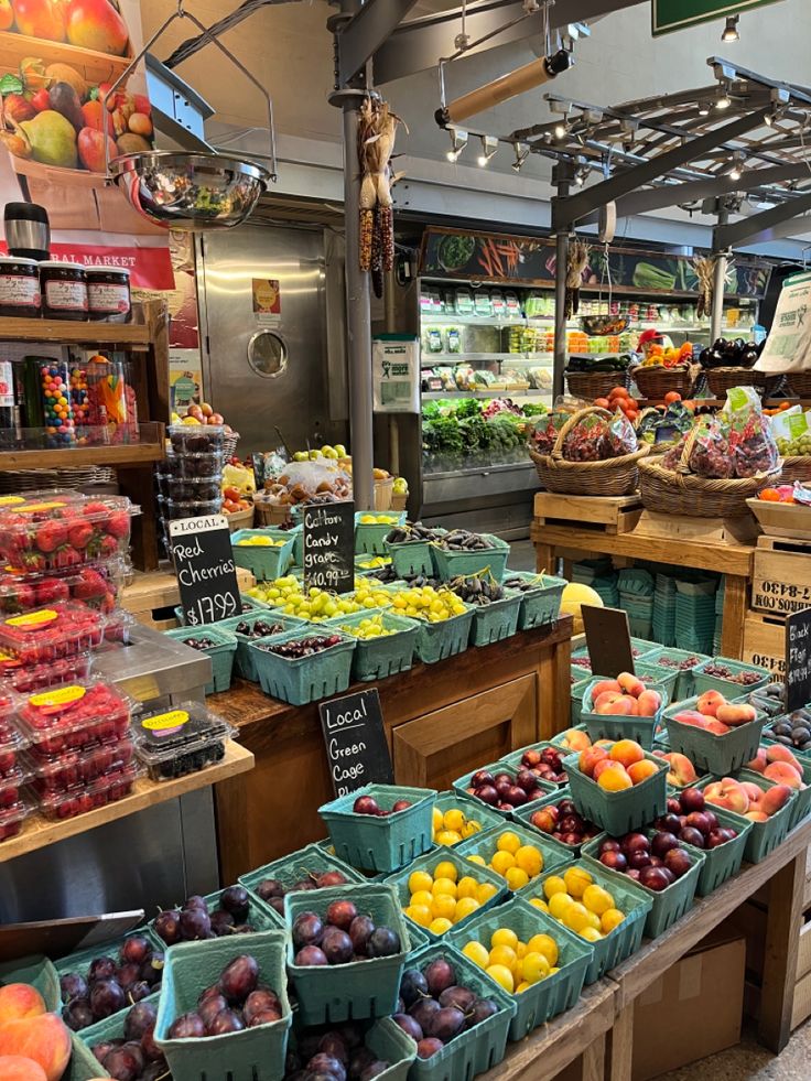 the produce section of a grocery store filled with lots of fresh fruits and veggies