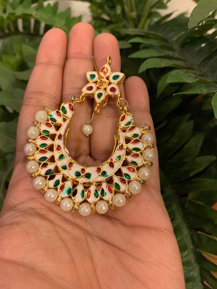 Premium quality gold-plated kundan chandbali earrings with moti (pearls). Very gorgeous pair. Care Instruction: Avoid heat & substances like perfume, deodorant, alcohol, etc and clean with silver/gold polish cloth. Store in airtight spaces like ziplock pouch or jewelry box. Elegant White Chandbalis With Meenakari, Elegant White Meenakari Chandbalis, Elegant White Tilla Chandbalis, White Kundan Chandbalis With Cutdana, Festive White Cutdana Bridal Earrings, White Kundan Chandbali Pearl Earrings, White Kundan Pearl Drop Earrings, Heavy Kundan Chandbalis In White, Heavy White Kundan Chandbalis