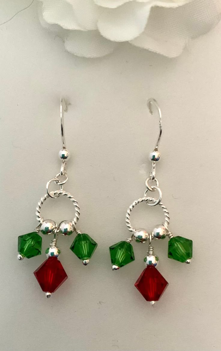 Christmas Holly Earrings comprising 925 Sterling Silver and Swarovski Crystals. 4.75cm drop. Very festive. Handmade Christmas Jewelry Making Tools, Cheap Cute Christmas Earrings, Cheap Christmas Earrings With Round Beads, How To Make Dangle Earrings Diy, Sterling Silver Dangle Jewelry For Christmas, Handmade Sterling Silver Christmas Earrings, Holiday Dangle Earrings With Ear Wire, Holiday Dangle Jewelry With Matching Earrings, Holiday Jewelry With Matching Dangle Earrings