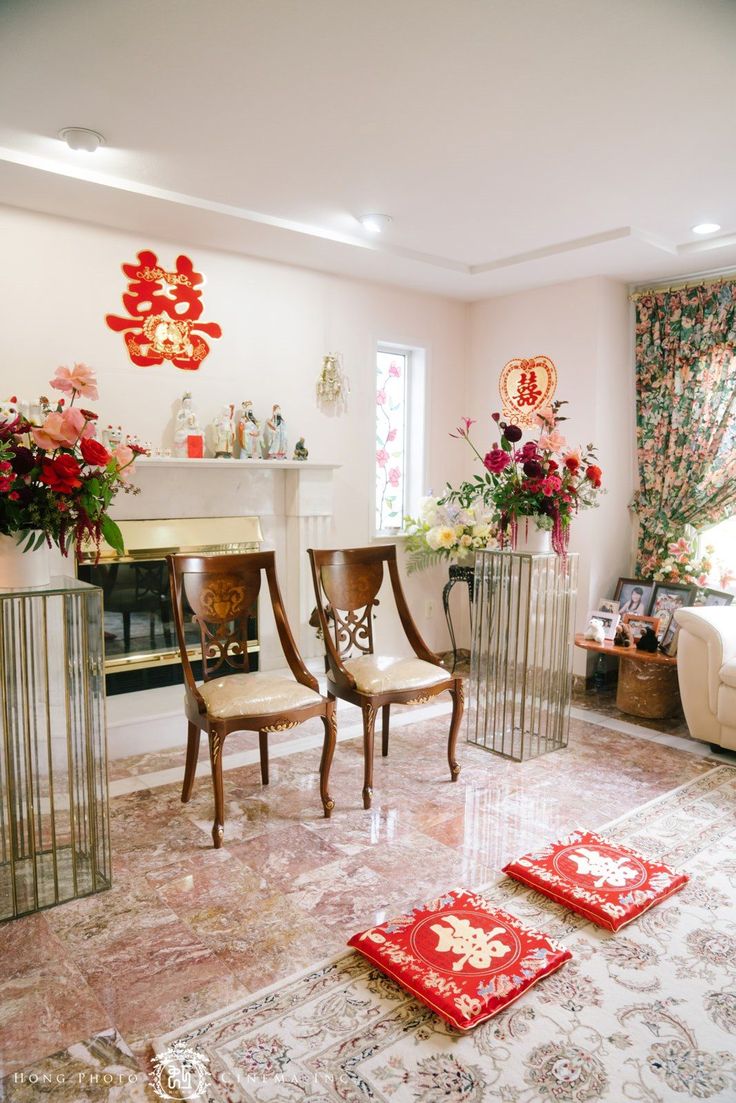 a living room filled with furniture and flowers