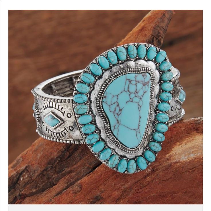 Conchos Around The Band Pop With Faux-Turquoise Stones 21/2" Wide At Center Stretches To Fit Most Wrists Blue Bohemian Bangle Jewelry, Western Style Blue Cuff Bangle Bracelet, Southwestern Style Silver Jewelry For The Beach, Bohemian Turquoise Concho Jewelry, Western Blue Jewelry For The Beach, Bohemian Turquoise Jewelry With Concho, Southwestern Style Nickel Free Blue Cuff Bracelet, Southwestern Style Blue Nickel-free Cuff Bracelet, Southwestern Blue Nickel-free Cuff Bracelet