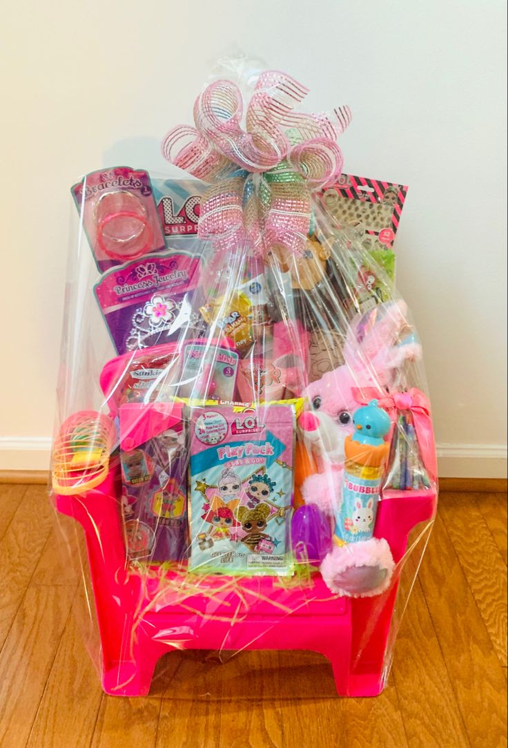 a pink basket filled with lots of toys