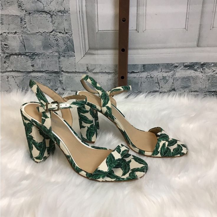 Gianni Bini Green Palm Frond And White Heeled Sandal Heel Height: 3” Vacation Ankle Strap Fabric Heels, Chic Floral Print Heels For Vacation, White Ankle Strap Heels With Floral Print, Floral Print High Heels For Vacation, Formal Floral Print Open Toe Sandals, White High Heel Sandals With Floral Print, White Floral Print High Heel Sandals, White Fabric Open Toe Heels, White Fabric High Heels