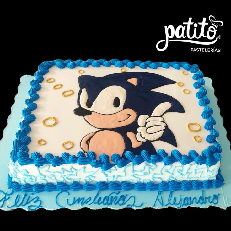 a sonic the hedgehog birthday cake with blue frosting and gold sprinkles