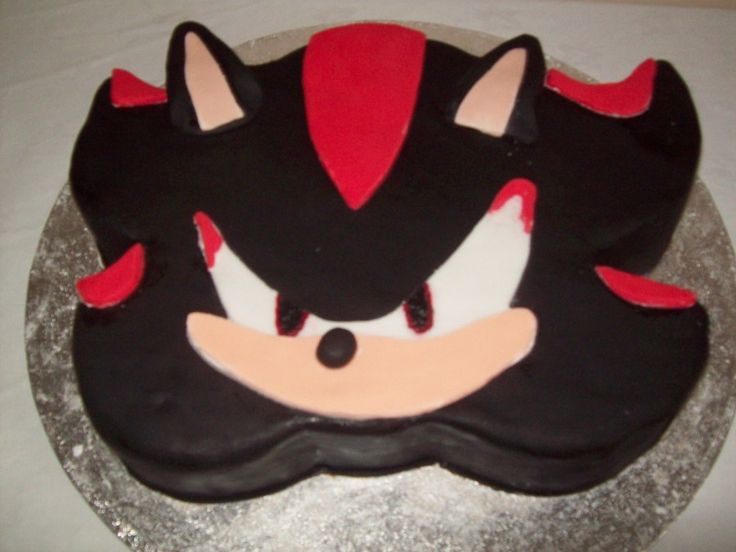 a cake that looks like the face of sonic the hedgehog on top of a table