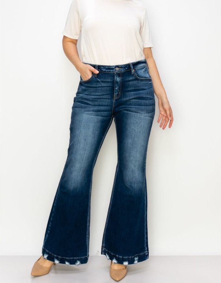 Embrace vintage vibes with ARTEMIS VINTAGE Mid Rise Flare Jean. These dark wash jeans feature a unique distressed hem for that extra touch of style. With a mid rise fit and luxurious stretch, they're both comfortable and chic. Perfect for spicing up any outfit.PRODUCT SPECIFICATIONS*Wide Hem with Distressed Detail*Mid-Rise Stretch Denim*Dark Stone Wash*Front Rise: 12 1/2", Inseam: 32.5"*Brand: Artemis Vintage*Online Only Fall Distressed Dark Wash Flare Jeans, Vintage Washed Blue Bottoms For Fall, Vintage Flare Jeans With Frayed Hem For Spring, Spring Vintage Flare Jeans With Frayed Hem, Retro Dark Wash Bottoms With Frayed Hem, Retro Denim Flare Jeans With Frayed Hem, Retro Flare Jeans With Frayed Hem, Fall Faded Jeans With Frayed Hem, Retro Frayed Hem Jeans For Fall