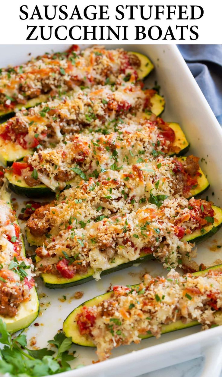 stuffed zucchini boats in a white casserole dish