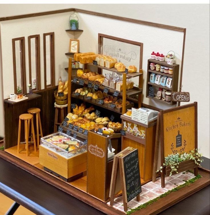 a miniature bakery display with pastries and other items