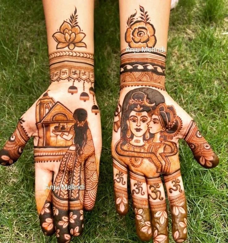 two hands painted with henna designs on them, one is showing the woman's face