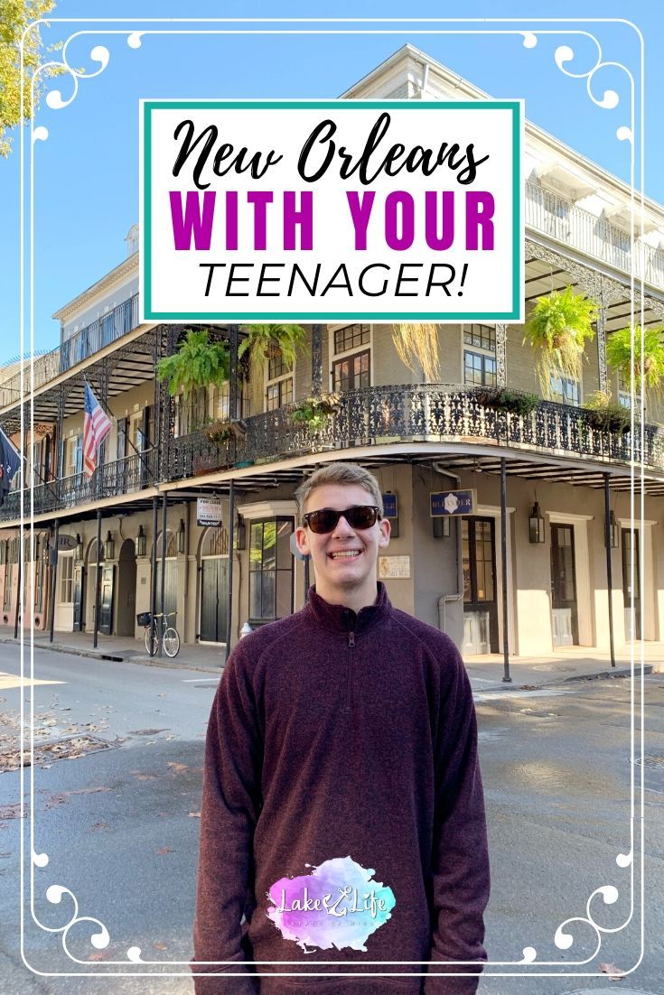 a man standing in front of a building with the words new orleans with your teenager