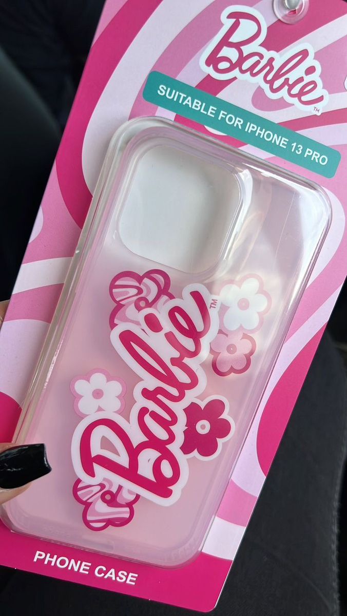 the phone case is pink and white with flowers on it's back cover that says barbie