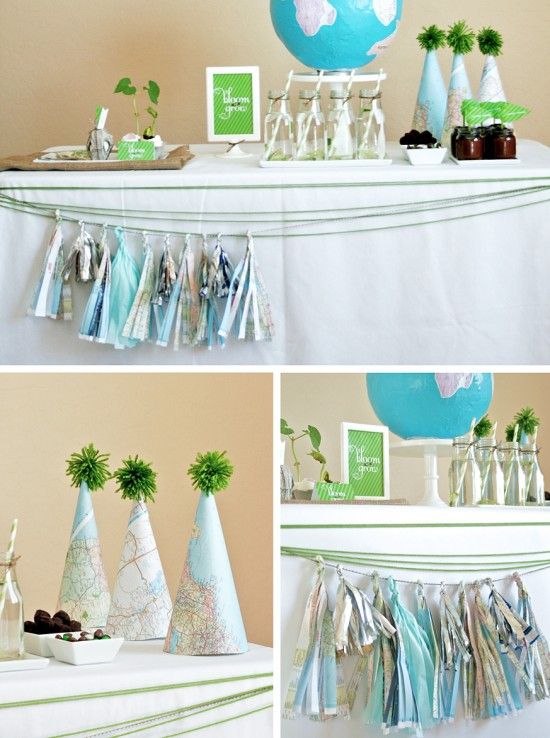 a table topped with lots of party decorations next to a blue and white ballon