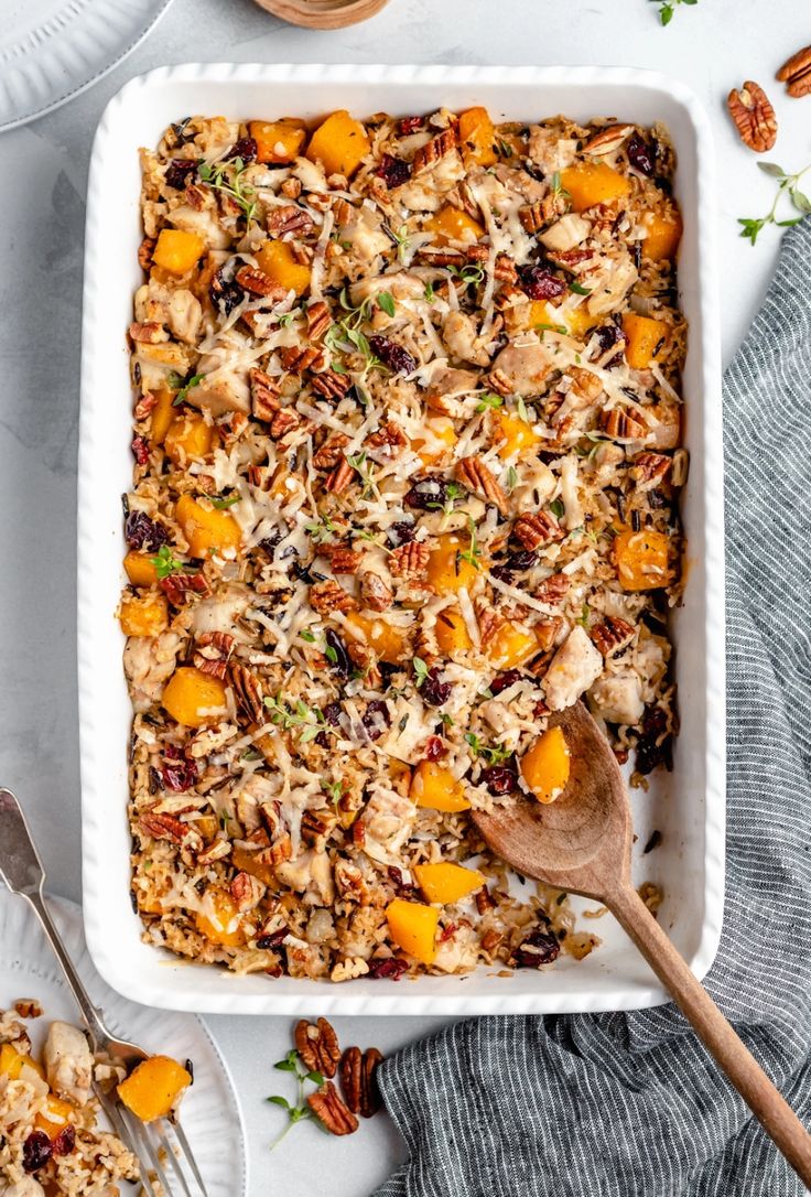 a casserole dish filled with rice and nuts