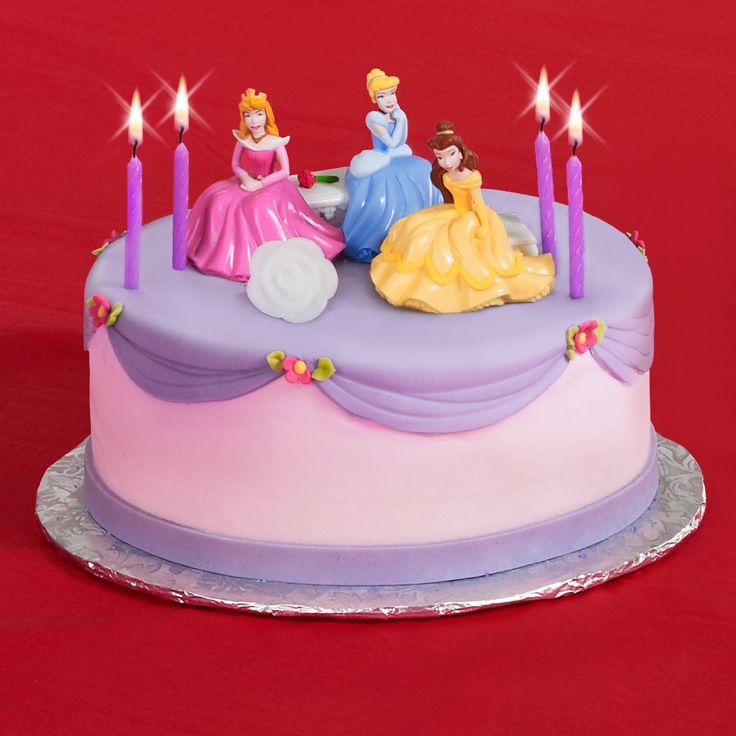 there is a birthday cake with princesses on it