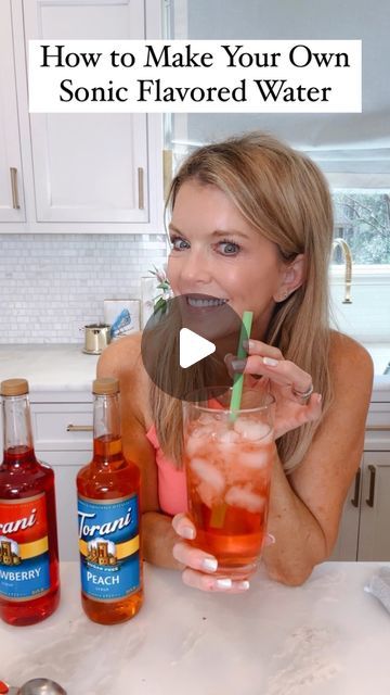 a woman holding up a drink in front of her face with the words how to make your own sonic flavored water