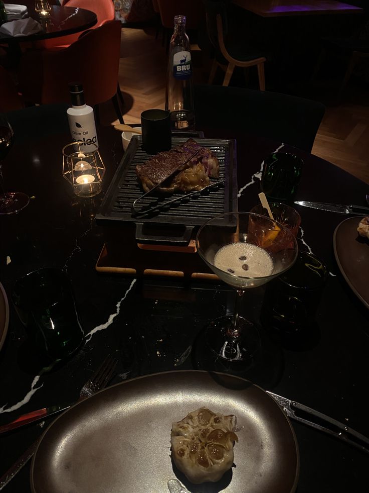 a table with food and wine glasses on it