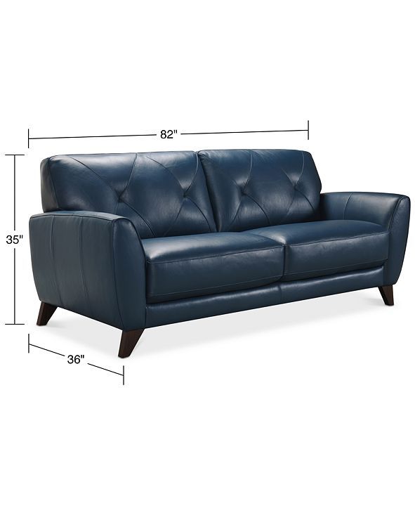 a blue leather couch with measurements for the seat and back cushions on top of it