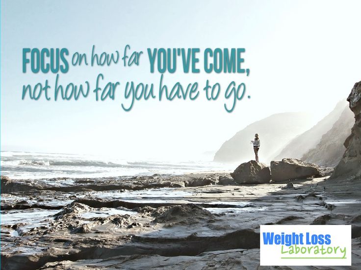 a man standing on top of a rocky beach next to the ocean with a quote above it