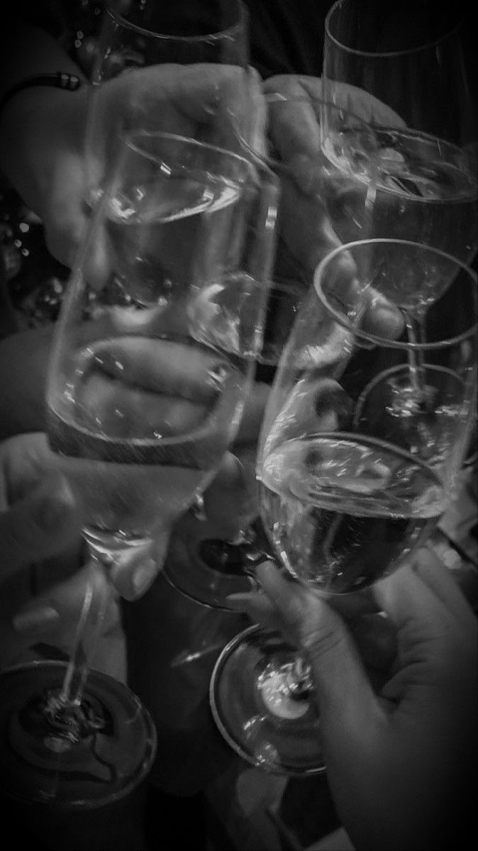 several people holding wine glasses in their hands