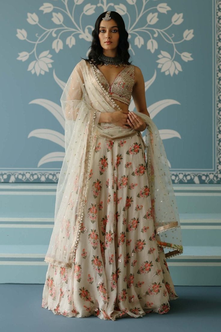 Esha Ivory Lehenga Set by Gopi Vaid, available on Indiaspopup.com Anarkali Style Pre-draped Floor-length Saree With Floral Embroidery, Off White Sharara With Floral Embroidery For Festive Occasions, Off White Saree Set With Gota Work, Festive Anarkali Pre-draped Saree With Floral Embroidery, Festive Off White Sharara With Floral Embroidery, Off White Floral Embroidered Sharara For Festive Occasions, Anarkali Palazzo Set With Floral Embroidery For Weddings, Wedding Palazzo Set With Floral Embroidery For Diwali, Floor-length Floral Embroidery Choli For Festive Occasions