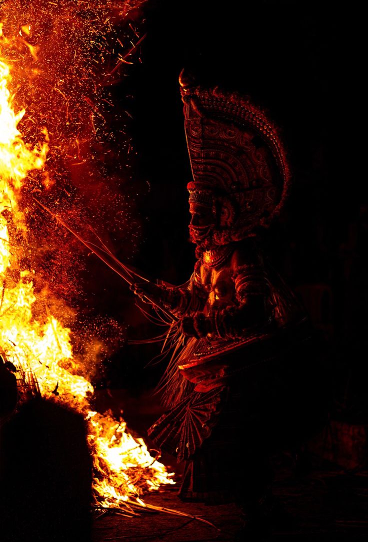 an image of a woman on fire in the dark