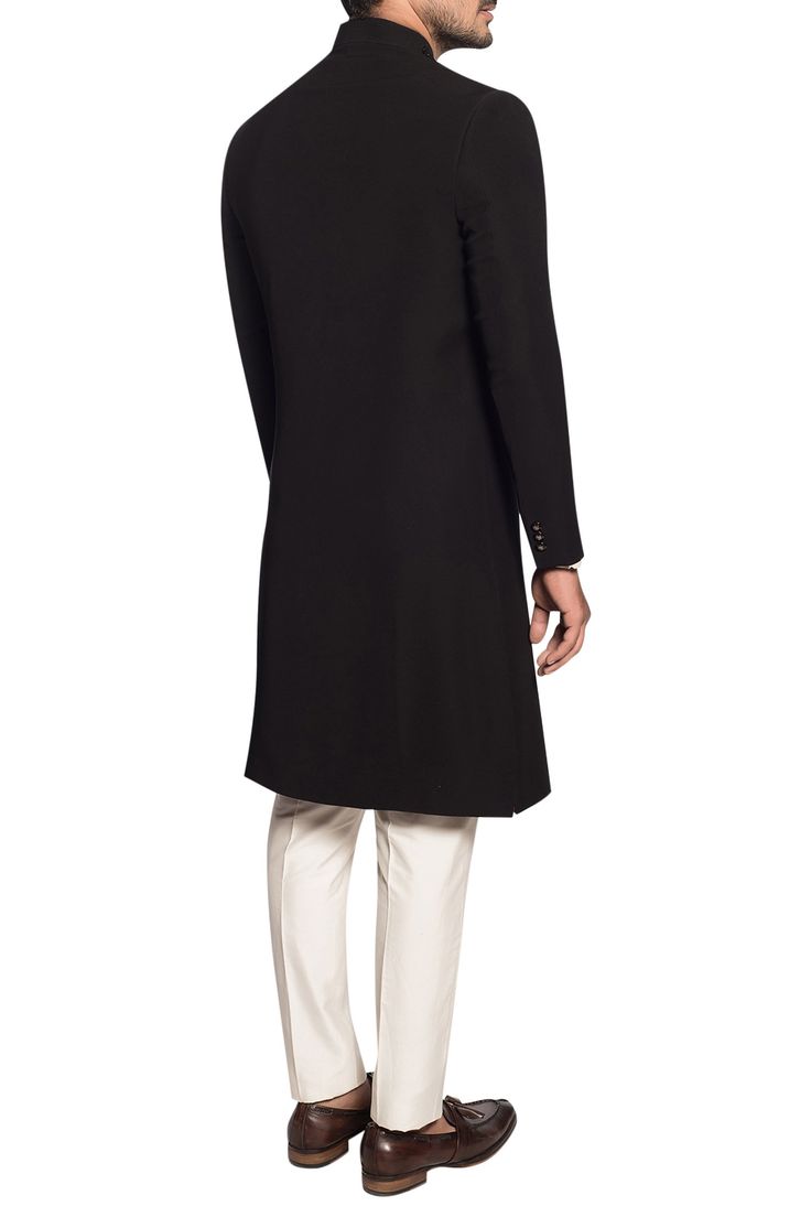 Adorned with regal dori and zardozi hand embroidered motif on the pocket, this classic black sherwani exudes timeless and effortless glamour. Paired with an off-white cotton silk kurta and matching trouser.
comes with kurta
comes with trouser
zardozi embroidery
dori embroidery - Aza Fashions Black Sherwani, Dori Embroidery, Embroidered Sherwani, Zardozi Embroidery, Silk Kurta, Luxury Sale, Embroidery Fabric, Festival Wear, Cotton Silk