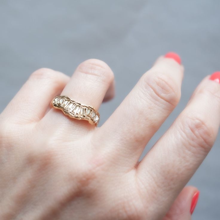 Yellow-hued diamond baguettes scatter across this V-shaped ring by Ellis Mhairi Cameron. Each stone is hand set in softly distressed gold, shining like buried treasure. Ellis draws inspiration from the medieval jewelry hoards found in Scotland. Her rings are unique, beautiful, and mysterious. Stones: Total .85tcw Yellow Baguette DiamondsMetal: 14k Yellow GoldMeasurements: Setting length: 18.9mm, Setting width: 8.5mm, Setting height: 2.9-2.1mm, Band width: 1.6-2.4mm Size 6, 6.5 in stock Shipping Wolf Jewelry, Buried Treasure, Medieval Jewelry, Baguette Diamond, Pearl Studs, Pearl Drop Earrings, Pearl Drop, V Shape, Pearl White