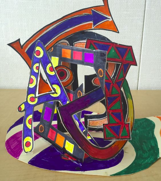 a colorful paper sculpture sitting on top of a table