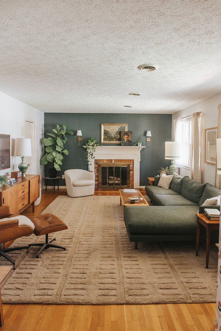 a living room filled with furniture and a fire place in the middle of a room