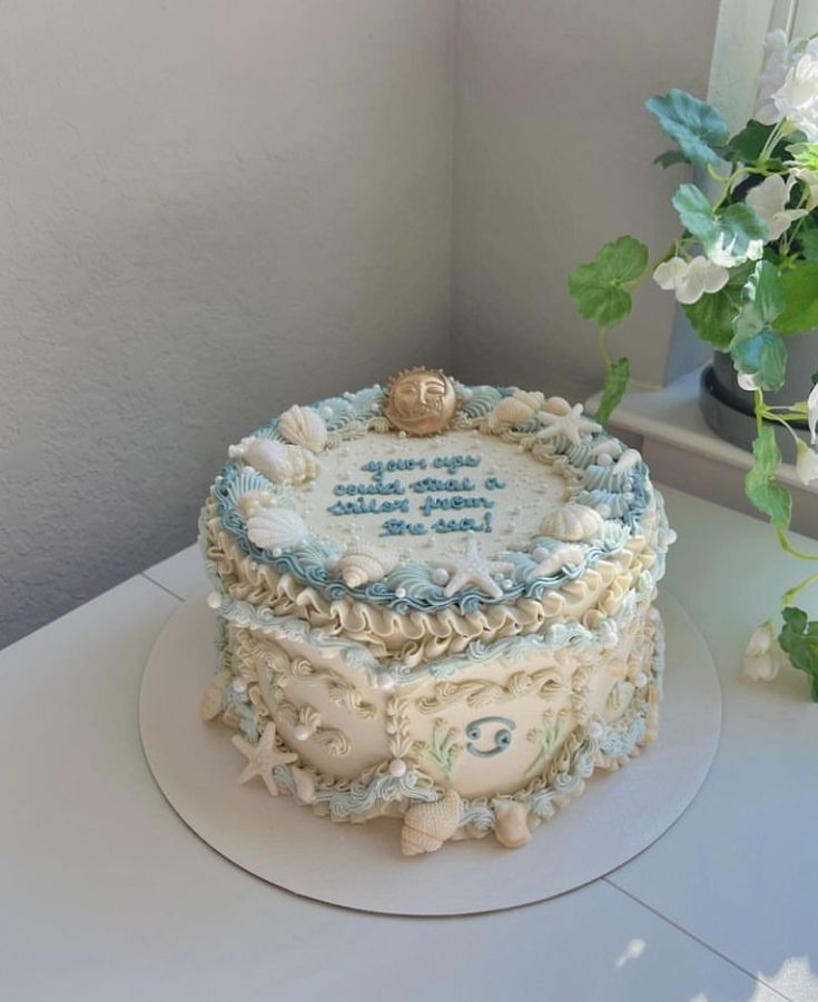 a birthday cake sitting on top of a white table