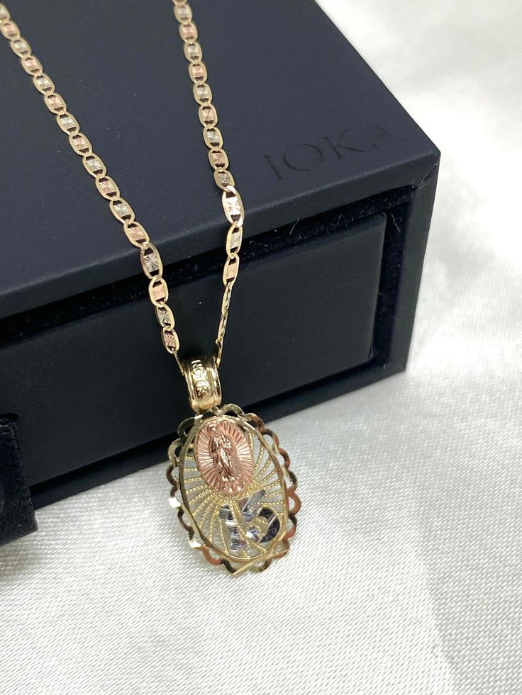 14K Gold Quinceanera Virgin Mary Round Pendant With 1.5mm Valentino Chain Necklace, 15 years old Birthday Necklace, Birthday Gift For girl ✅ PENDANT SPECIFICATIONS:  * Single Sided * Height: 0.71 in. (18 MM) * Width: 0.47 in. (12 MM) * Average Weight: 0.89 gr. ✅ CHAIN SPECIFICATIONS:  * Clasp: Spring-Ring  * Width: 1.5 MM ➤ Length: 16 inches   Avg Weight: 1.08 ➤ Length: 18 inches   Avg Weight: 1.2 ➤ Length: 20 inches   Avg Weight: 1.27 ➤ Length: 22 inches   Avg Weight: 1.42 ➤ Length: 24 inches Quinceanera Jewelry Necklaces, Quince Necklace Gold, Quince Necklace, Quince Jewelry, Quinceanera Necklace, Gold Quinceanera, Quinceanera Jewelry, 15 Necklace, Quinceanera Pink