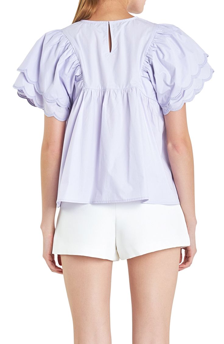 Tiered scalloped ruffles with embroidered edges charm an airy cotton top styled in a sweet babydoll silhouette. Back keyhole with button-and-loop closure Jewel neck Short sleeves 100% cotton Hand wash, dry flat Imported Summer Wardrobe Essentials, English Factory, Women Blouse, Pajama Robe, Baby Boy Shoes, Made Clothing, Babydoll Top, Denim Leggings, Jewel Neck