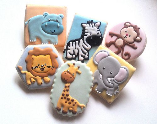 several decorated cookies with animals on them