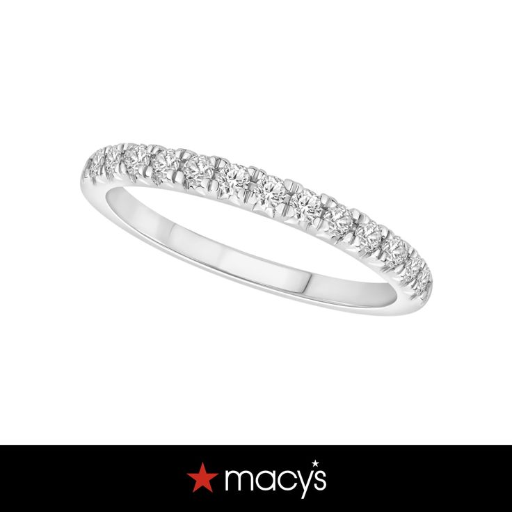 a white gold wedding band with five diamonds on the top and bottom, set in 18k