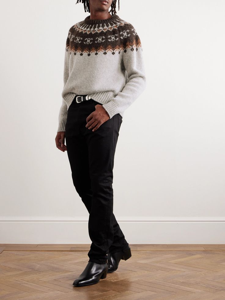 Fair Isle has been a seasonal classic for centuries, and for good reason. CELINE HOMME's sweater is knitted from naturally insulating wool in a take on the pattern that incorporates its 'Triomphe' emblem. It's ideal for winter outings and holidays. Nordic Wool Sweater For Fall, Wool Jacquard Knit Sweater For Cold Weather, Wool Sweater With Fair Isle Pattern For Fall, Fall Wool Sweater With Fair Isle Pattern, Fitted Nordic Wool Sweater, Scandinavian Jacquard Knit Sweater For Fall, Scandinavian Style Jacquard Knit Sweater For Fall, Classic Winter Sweater With Fair Isle Pattern, Classic Fair Isle Sweater For Winter