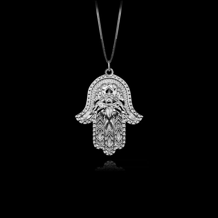 Elevate your style with our 14k Gold Hamsa Hand Pendant. This solid gold necklace showcases exquisite craftsmanship, symbolizing protection and blessings. The 14 karat gold Hamsa Hand pendant is more than just jewelry; it's a fine representation of symbolism and cultural significance, also available in 18k yellow gold. PENDANT INFORMATIONThis pendant is made of real, solid gold.• Made in USA• Material: 14k or 18k solid gold• Finish: polished• Height: 1.25" (31,5 mm) x Width: 0.95" (24 mm)• Penda Phoenix Pendant, Hand Pendant, Gold Hamsa, Hamsa Pendant, Gold Dragon, Solid Gold Necklace, Solid Gold Chains, Mini Pendants, With Meaning