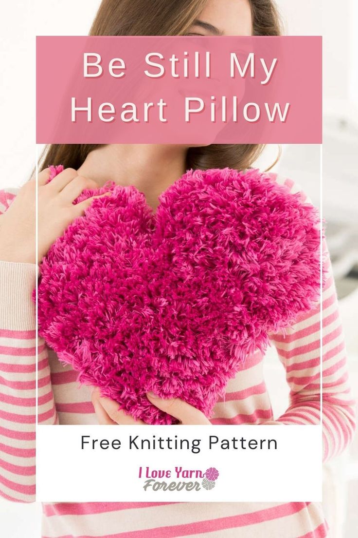 a woman holding a pink heart pillow with the text be still my heart pillow free knitting pattern